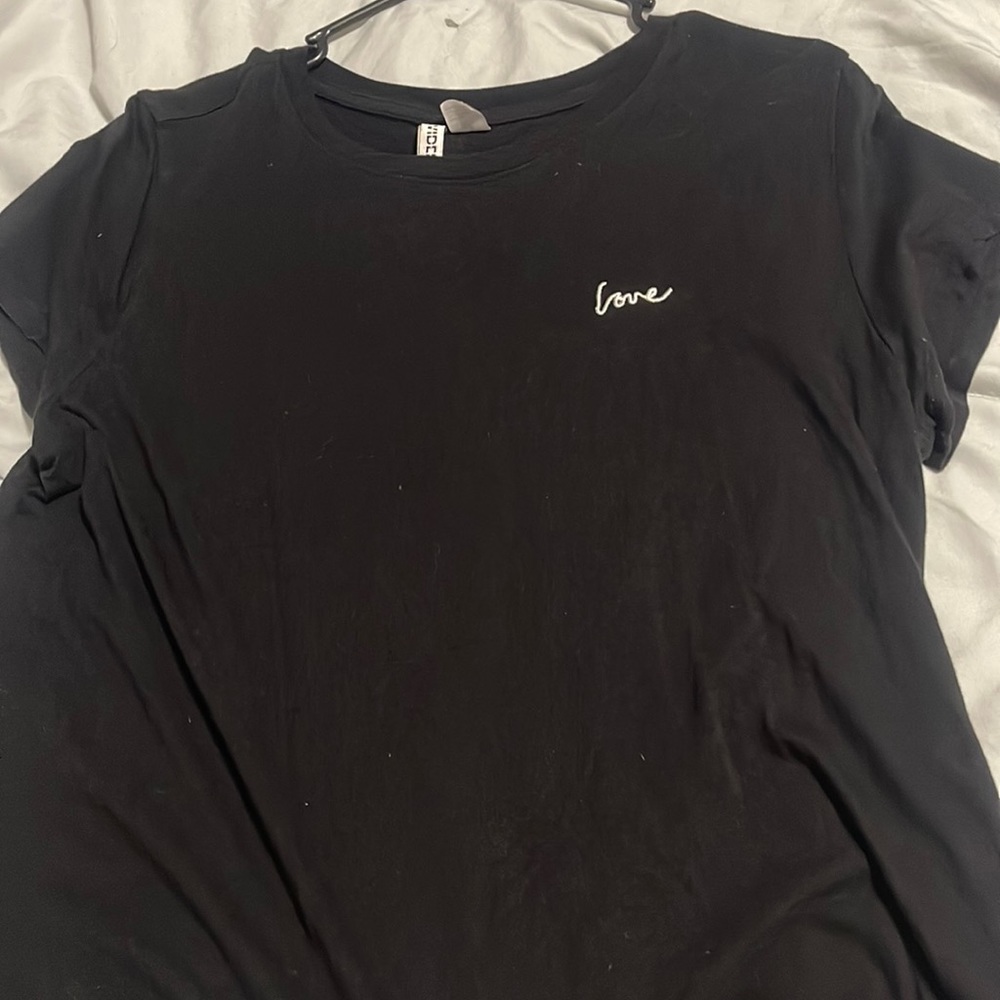 Black “love” shirt. Size large. Brand divided.
